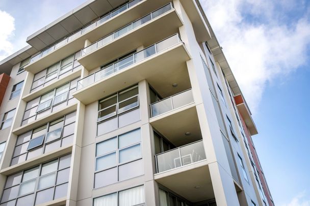 Ducted air-conditioning, district views, and parking for two in a most convenient city location; Spire Apartments - Photo 1