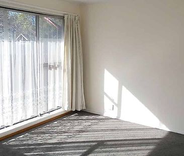 A fully fenced home in a building of two dwellings - Photo 1