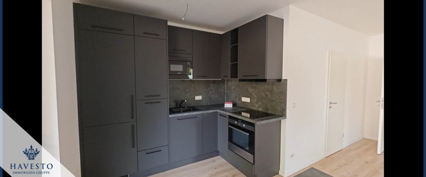 Erstbezug 2,5 Zimmer Wohnung 1. OG mit Balkon und wählbarer Einbauküche - Photo 1