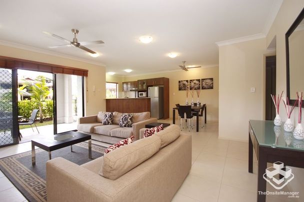 Stunning 2-Bedroom Apartment Fully Furnished in a Tropical Resort Setting - Photo 1