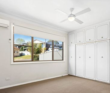 Live in comfort while relishing the picturesque beauty of Lake Macq... - Photo 1