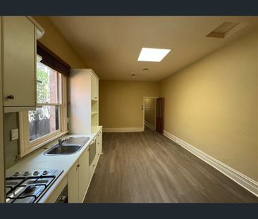 Renovated Victorian Charm with Courtyard and Off-Street Parking - Photo 6