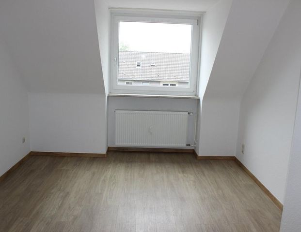 Gut ausgestattete Dachgeschosswohnung mit Blick ins Grüne - Foto 1