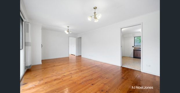 CONVENIENTLY LOCATED, FRESHLY UPDATED TWO-BEDROOM UNIT - Photo 1