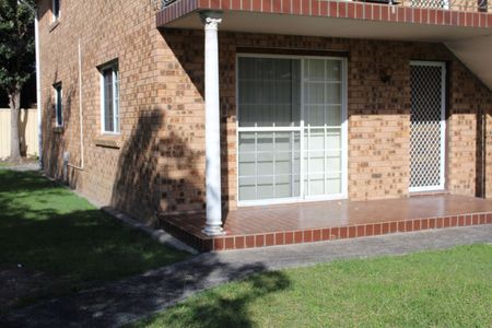 Centrally Located - Bottom Apartment - Water & Lawns Included - Photo 5