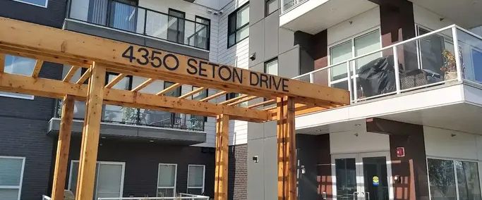 Two bedrooms with large balcony of view in a newer building | 314 - 4350 Seton Dr SE, Calgary - Photo 1