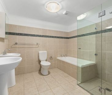 SPLIT-LEVEL TWO BEDROOM TOWNHOUSE IN TIGHTLY HELD COMPLEX - Photo 2