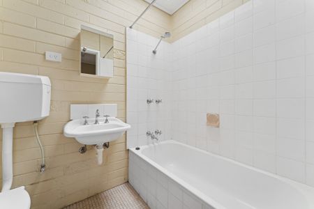 Tidy Two-Bedroom Unit in the Heart of Town - Photo 4