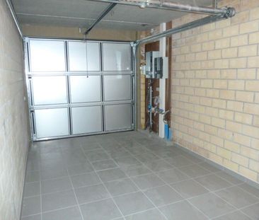 Centraal gelegen halfopen woning met drie slpk en garage - Foto 1