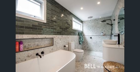 This well presented, elevated, and renovated home is sure to impress! - Photo 2