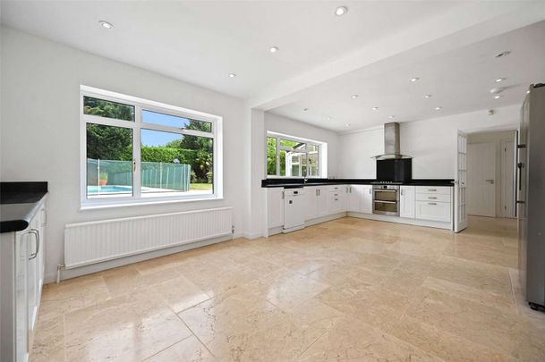 A modern neutrally decorated five bedroom, two bathroom detached house with four receptions and a swimming pool - Photo 1