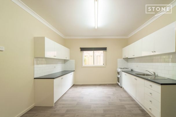 Two bedroom home with lawn maintenance included - Photo 1