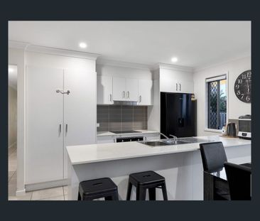 New Home Bliss: 4 Bed, 2 Bath Rental with Open Living & Landscaped ... - Photo 2