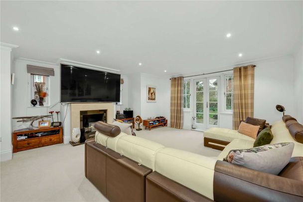 Set within a prestigious private estate, this impressive six bedroom residence offers generous and versatile accommodation perfectly designed for modern family living. - Photo 1