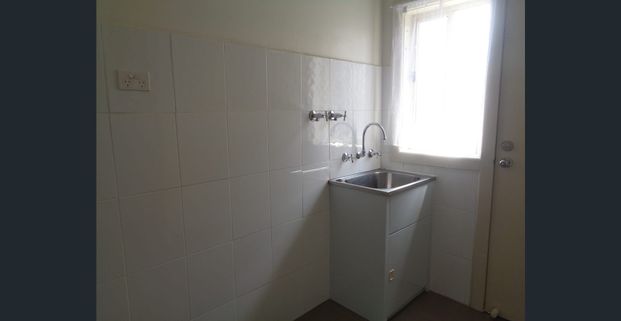 Charming 3-Bedroom Unit in a Convenient Location! - Photo 1