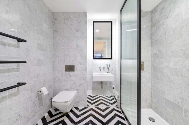 Large wrap around garden balcony, with dual aspect south westerly views from this stylish two bedroom apartment, located in Wardian's West Tower. - Photo 1