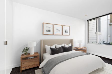 Modern Two-Bedroom Townhouse with Balcony and Secure Garage - Photo 2