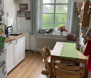 Charmante 3-Zimmer-Wohnung mit Kamin & Gartenanteil in Kiel-Hassee - Foto 1