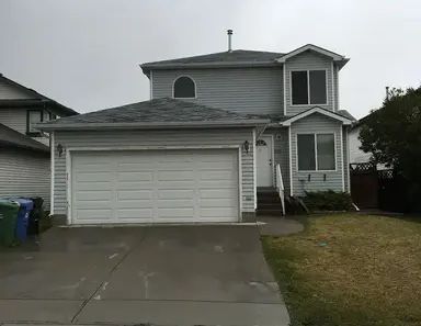 3 Bedroom 2.5 Bathroom Double Garage Backing onto Green Space House | 126 Saratoga Close Northeast, Calgary - Photo 1