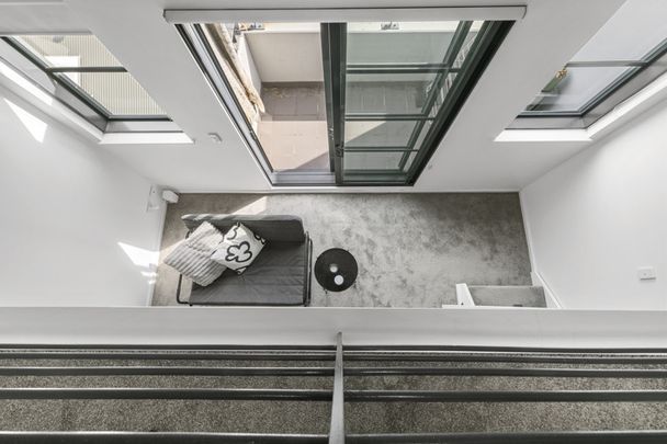 Dual-Level "Loft-Style" Apartment in Convenient Locale with Parking - Photo 1