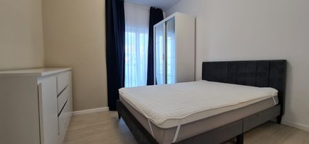 For rent in Cluj-Napoca, in the Buna-Ziua district, a modern apartment composed of 2 bedrooms, living room, 2 bathrooms and a terrace of 50 m². The apartment is perfect for a student who uses the car to go to university courses. - Fotografie 3