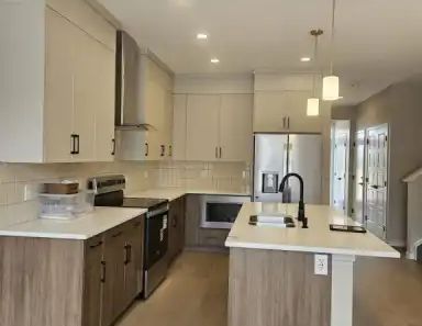 Spacious 4 Bedroom Duplex in family friendly neighborhood of Carrington | 394 Carringvue Grove Northwest, Calgary - Photo 1