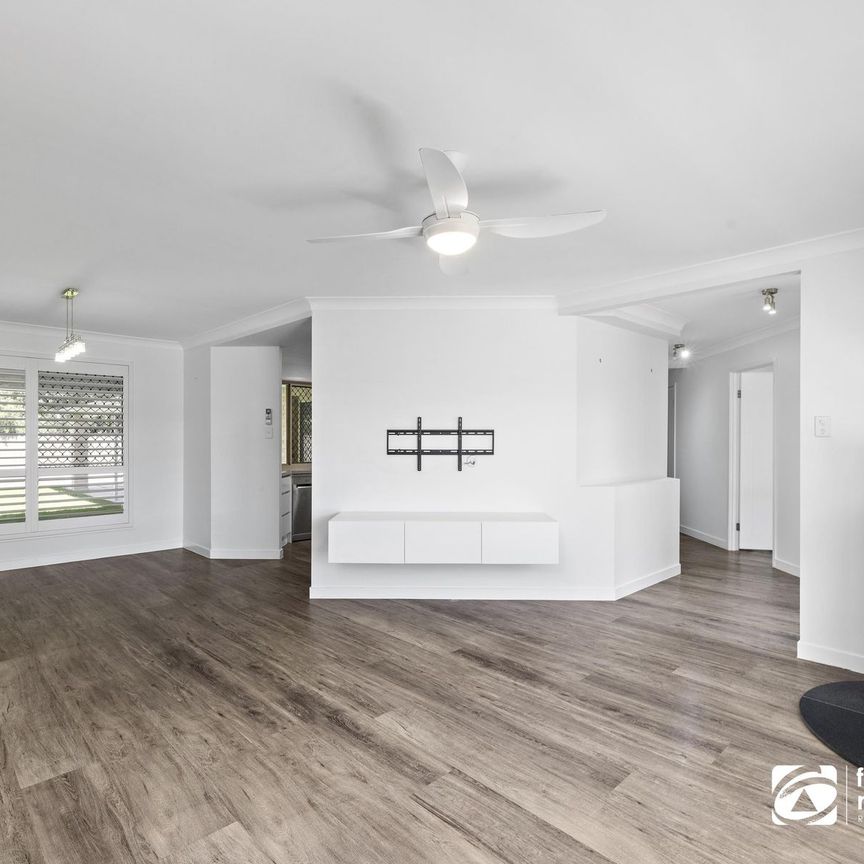 STUNNING LOW SET FAMILY HOME IN WELLINGTON POINT - 4 BEDROOMS + STUDY - Photo 1