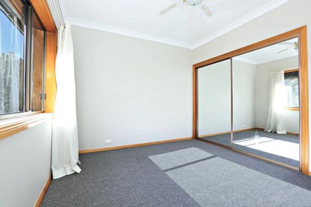 Light-Filled Apartment Offering Comfort and Convenience - Photo 1