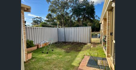 Neatly presented three bedroom home - Photo 2