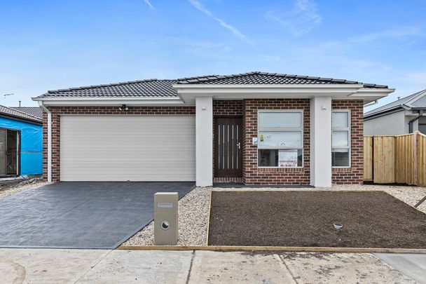 Stunning 4-Bedroom Home in Beveridge! - Photo 1