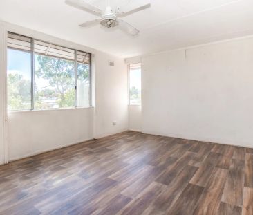 Bright and Spacious Top-Floor Unit - Photo 2