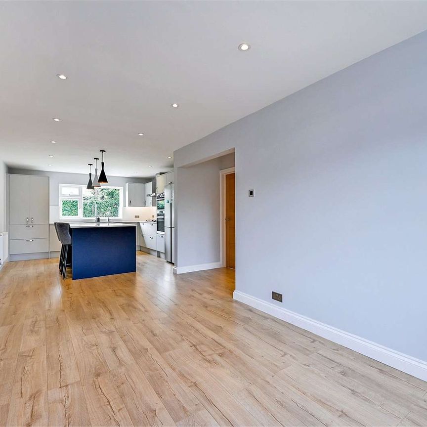 This beautifully refurbished 5/6-bedroom detached home is set in a quiet spot with stunning Chiltern Hills views, offering spacious, light-filled accommodation finished to a high standard. - Photo 1