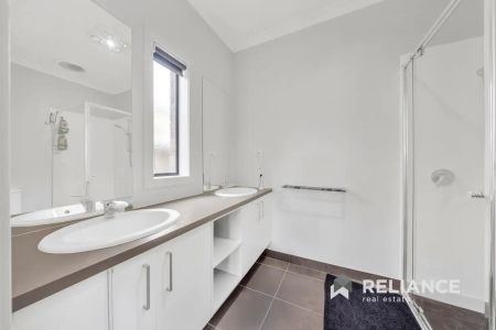 “Quality Metricon Family Home with Multiple Living Spaces Near Manor Lakes Shopping & Train Station” - Photo 2