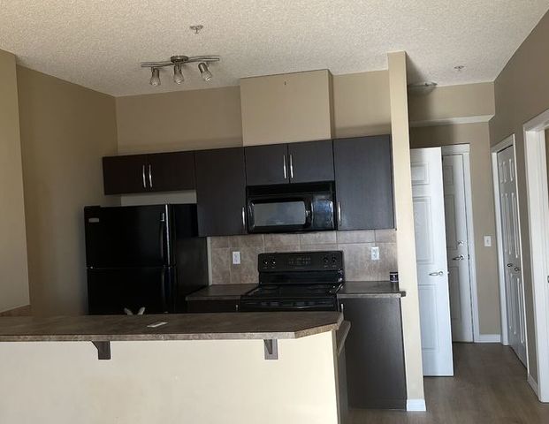 Cozy super convenient heated garage Condo | 1727 54 St SE, Calgary - Photo 1