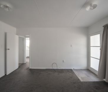 Tidy two bedroom home, close to the hospital - lawns included - Photo 1