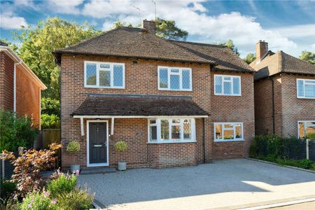 Located in the beautiful village of Pyrford, this lovely home offers flexible accommodation across two floors, complemented by a generous private rear garden backing onto woodland. - Photo 5