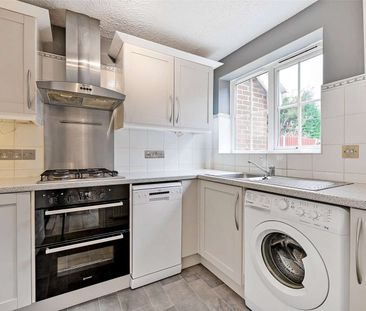 A modern three bedroom home with garage and off-street parking in a... - Photo 2