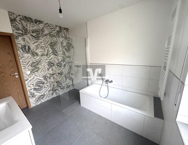 Erstbezug nach Sanierung: Stilvolle 2,5-ZKB mit EBK und Garten in MA-Neuhermsheim! - Photo 1