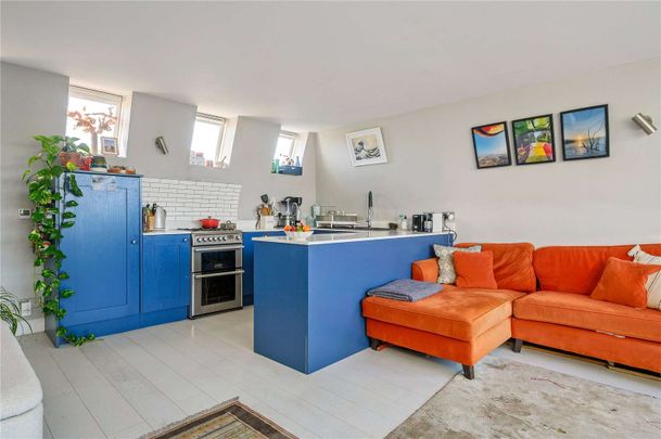 Bright split-level two bedroom home on the top floors of a period conversion - Photo 1