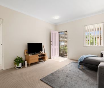 Nestled in a peaceful complex, this delightful two-bedroom unit off... - Photo 1