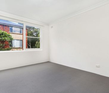 GROUND FLOOR TWO BEDROOM APARTMENT WITH BALCONY AND LOCK UP GARAGE - Photo 1