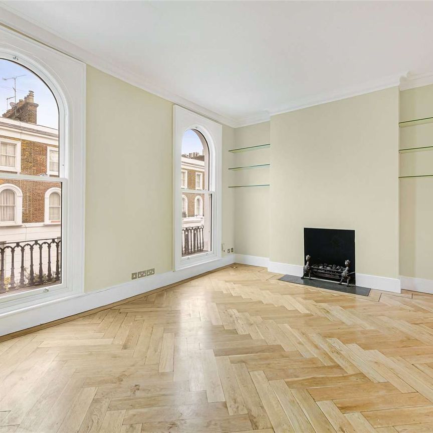 A first and second floor maisonette, benefitting from a private roof terrace, and wooden floors in the living area, conveniently located moments from the amenities of Kings Road SW3. - Photo 1