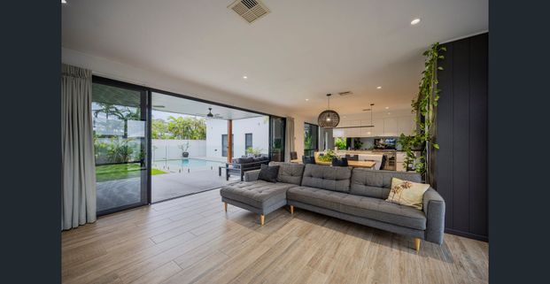 Stylish Four-Bedroom Home With Poolside Living - Photo 1