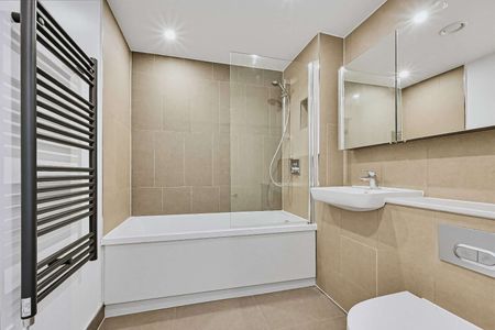 Modern two-bedroom apartment with open-plan living, a private balcony, contemporary finishes and access to a communal roof terrace. - Photo 4