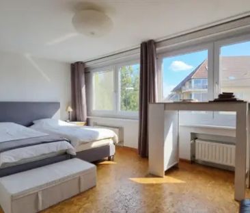 Sfeervol duplexappartement met terras en 1 parking. - Foto 2