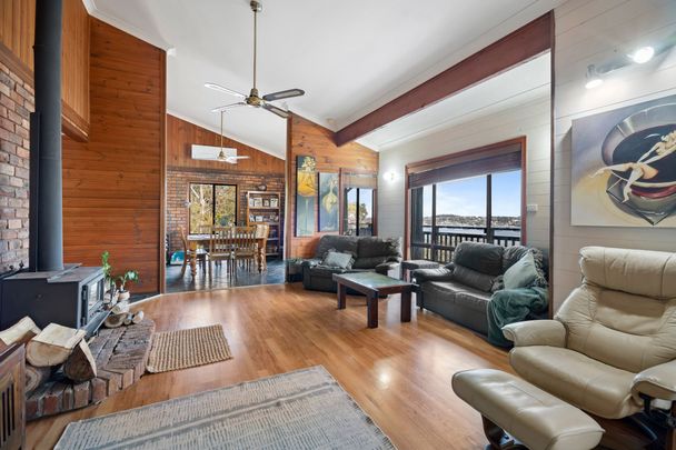 TOP OF THE TREE TOPS HOME WITH LAKE VIEWS - Photo 1