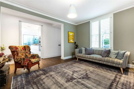 A stunning extended and meticulously refurbished house on arguably one of West Putney's prettiest streets. - Photo 2