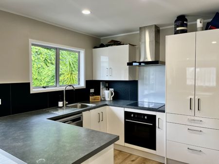 Step into this stunningly renovated home, perfect for stylish and comfortable living. - Photo 3