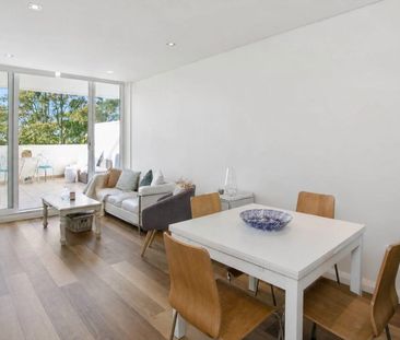 Sun-Drenched Dual-Level Living with Resort-Style Facilities - Photo 2