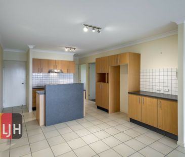 TOP FLOOR THREE BEDROOM UNIT WITH DOUBLE GARAGE & LARGE DECK! - Photo 1